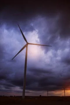 Wind turbines with a dark sky Stock Photos