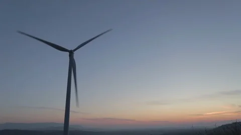 Wind turbines with dramatic sunset clouds Video stock 123477892