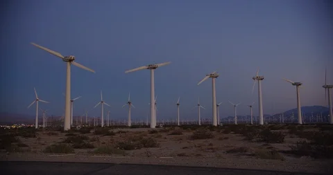 Wind turbines during sunset hour in Palm Springs, California Stock Footage 115095689
