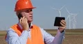 Wind Turbines Engineer Use Mobile Phone Touch Tablet Contact Maintenance Team 4k or 4k+ Resolution