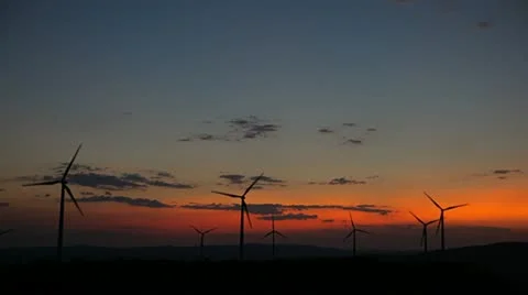 Wind Turbines in Eolic Park at the sunset Stock Footage