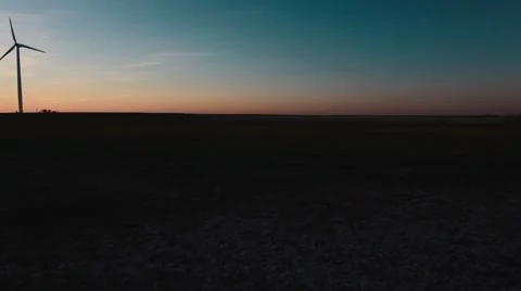 Wind Turbines Far View Pan Left - Sunset.mp4 Stock-Footage 53504208