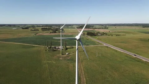 Wind turbines on a farm field during strong wind Stock Footage 170266794