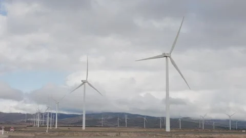 Wind turbines farm generating clean renewable energy Stock Footage 327550149