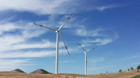 Wind turbines in a farm, generating renewable electrical energy Stock Footage 160751796
