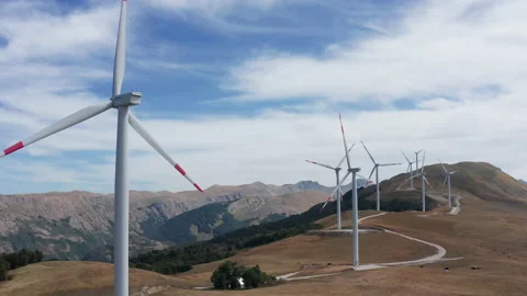 Wind turbines in a farm, generating renewable electrical energy Stock Footage 160765348