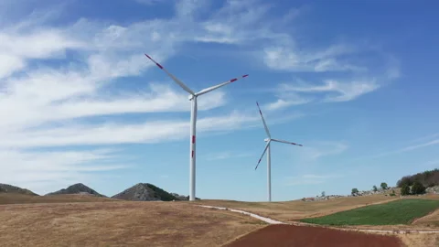 Wind turbines in a farm, generating renewable electrical energy Stock Footage 160772884