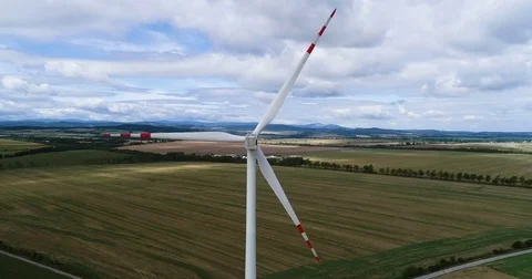 Wind turbines on the field during cloudy day Stock Footage 80235864