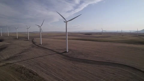 Wind Turbines in a Field Stock Footage 245774035