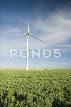 Wind turbines at the field Stock Photos