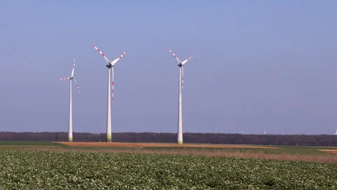 Wind turbines on fields in Austria Stock Footage 99890513