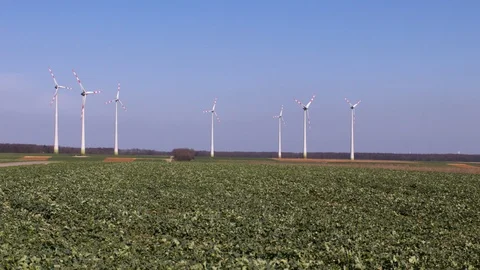 Wind turbines on fields in Austria Stock Footage 99890897