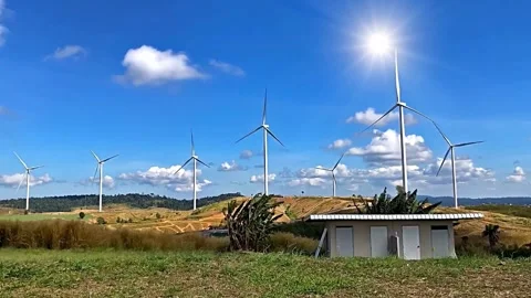 Wind Turbines Generating Clean Energy on Hilltop Landscape Stock Footage 310378271