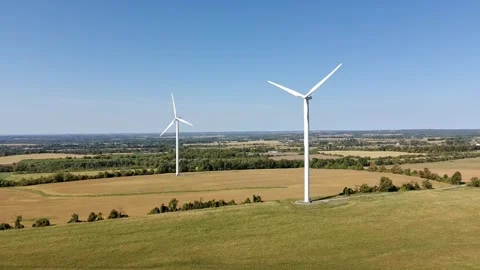 Wind turbines generating clean energy in Canada Stock Footage 317555044