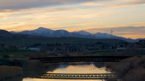 Wind turbines generating clean power at sunset Stock Footage 106737859
