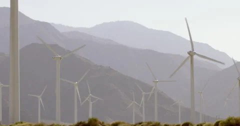 Wind turbines generating electricity in the mountains 4K Stock Footage 63844916