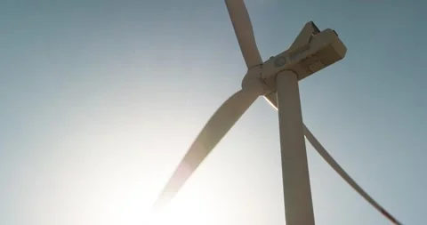Wind turbines generating electricity with wind energy against a clean sky backgr Stock Footage 292799825