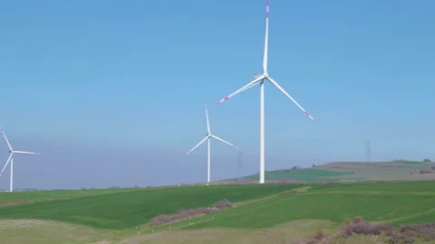 Wind turbines generating energy from the wind Stock Footage 279327880