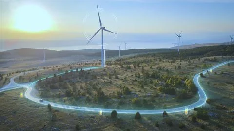 Wind turbines generating power. Electrical energy to EV's driving on roads Foto stock