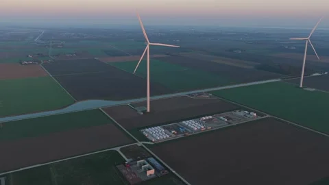 Wind turbines generating power for energy storage battery units Stock-Footage 332680779