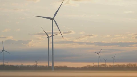 Wind turbines generating renewable energy, morning beautiful sunrise light Video stock 127197850