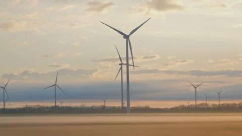 Wind turbines generating renewable energy, morning beautiful sunrise light Video stock 127197984