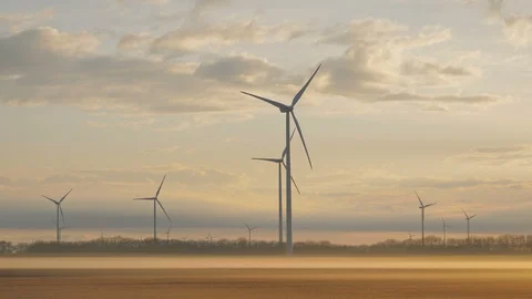 Wind turbines generating renewable energy, morning beautiful sunrise light Video stock 127198309