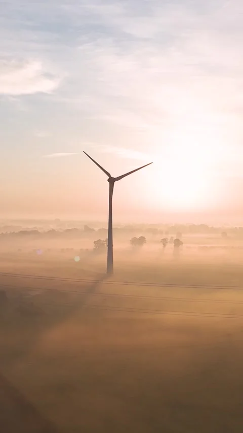 Wind turbines generating renewable energy at sunrise Stock Footage 288241697
