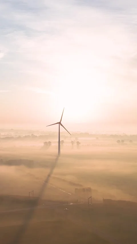 Wind turbines generating renewable energy at sunrise Video stock 288241765