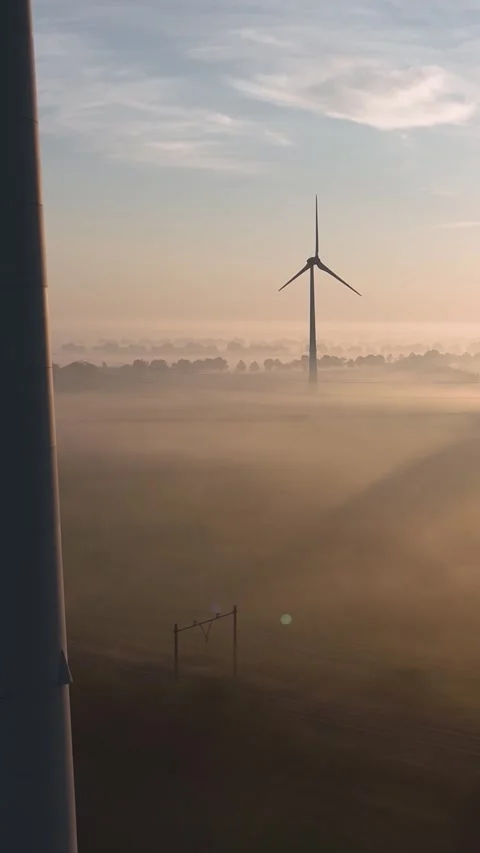 Wind turbines generating renewable energy at sunrise Stock Footage 288241785