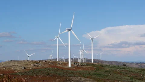 Wind turbines generating renewable energy on mountain landscape Vídeos de archivo 319014943