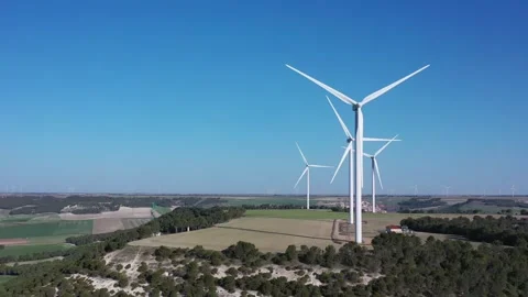 Wind turbines generating renewable energy – wind farm producing electricity Stock Footage 330528848