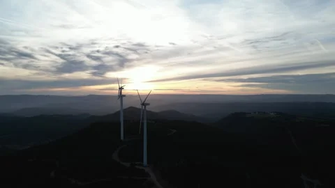Wind turbines generating renewable energy at sunset Stock Footage 331633628