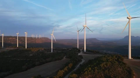 Wind turbines generating renewable energy at sunset Stock Footage 331633893
