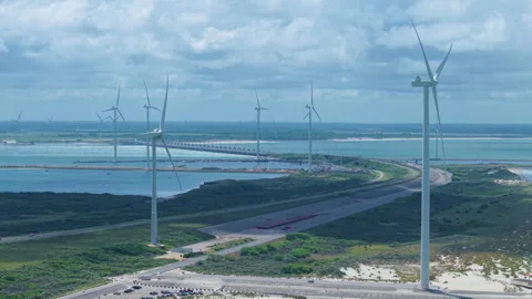 Wind turbines generating renewable energy with the Eastern Scheldt storm surge Stockbeeldmateriaal 338127656