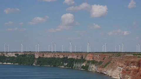 Wind turbines generating renewable energy on a coastal cliff Stock-Footage 342649836