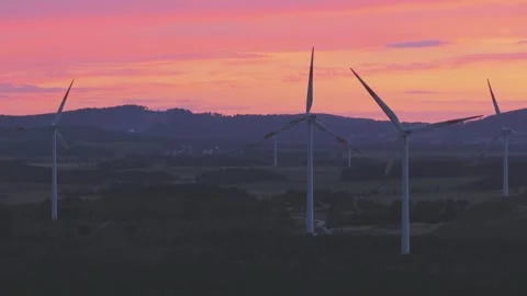 Wind Turbines Generating Renewable Energy at Sunset Over Rural Landscape Stock-Footage 345111329