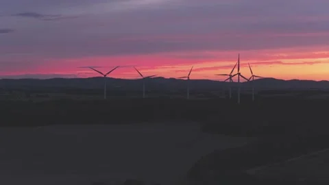 Wind Turbines Generating Renewable Energy at Sunset Over Rural Landscape Stock-Footage 345111887