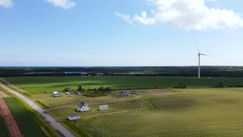 Wind turbines generating renewable green energy in rural landscape, Canada Stock Footage 339349065