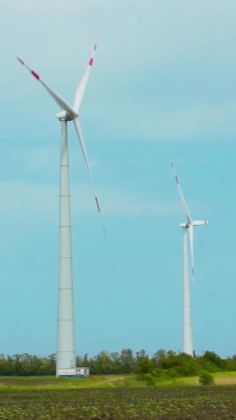 Wind turbines on green field in countryside, aerial view 스톡 동영상 244053353