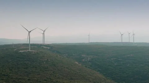 Wind Turbines on a Hillside Landscape Stock Footage 282928084