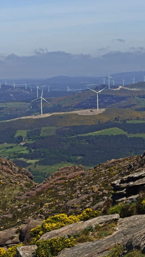 Wind turbines on hillside landscape Vídeo Stock 338294178