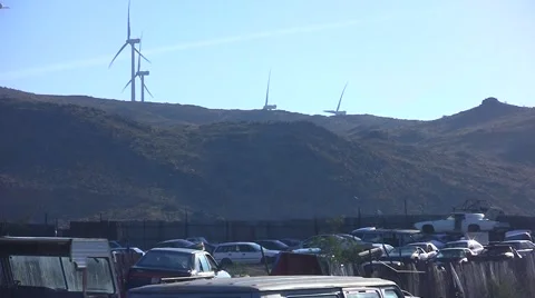 Wind Turbines with Junkyard in Foreground Stock Footage 42001668