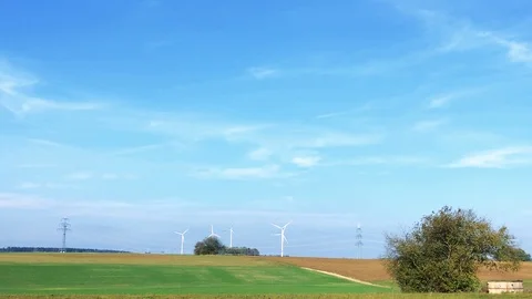 Wind turbines in landscape producing renewable energy Stock Footage 118526616