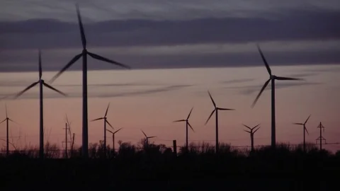 Wind turbines late dusk E -widens Stock Footage 104384312