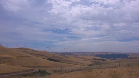 Wind Turbines Lined Up On a Hill Stock Footage 91877817