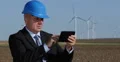 Wind Turbines Maintenance Engineer Check Energy Production Use Tablet Software 4k or 4k+ Resolution