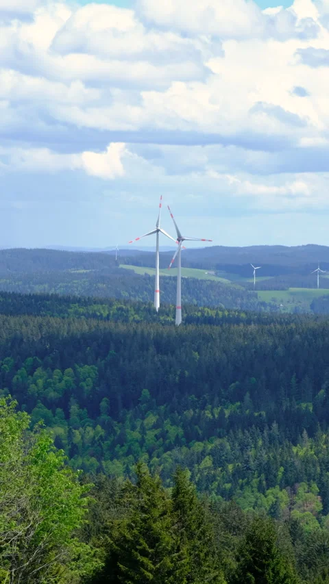 Wind turbines on the mountain in the low clouds and fog Stock Footage 278127284