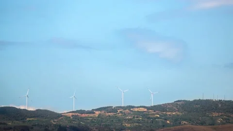 Wind turbines on mountain time lapse with beautiful blue sky and clouds Stock Footage 131367130