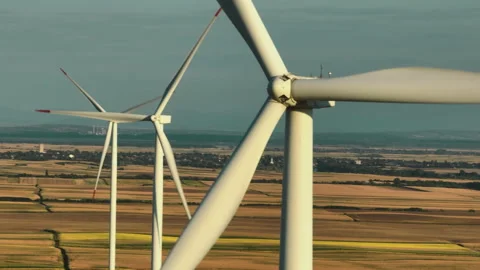 Wind turbines moving in a field Stock Footage 210699559